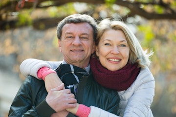 Happy older couple with dental implants