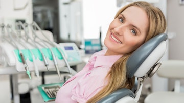 female patient sat in dental chair awaiting treatment