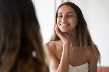 Woman smiling looking in the mirror